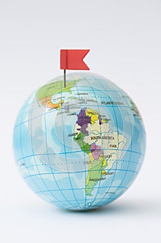 Model Globe With Red Flag Pin In North America