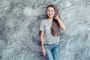 Model in gray t-shirt over street wall