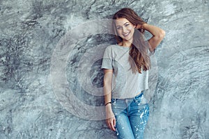 Model in gray t-shirt over street wall