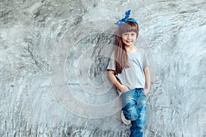 Model in gray t-shirt over street wall