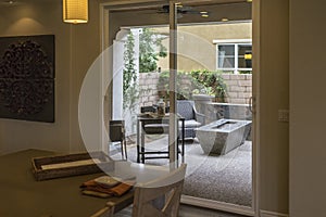 Model home dining room and patio, California.