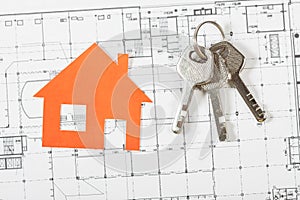 Model house on construction plan for house building.