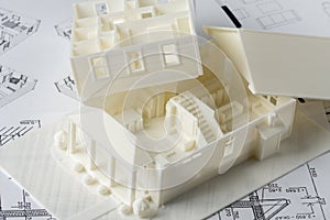 Model of the house parts floor and roof printed on a 3D printer with white filament by FDM technology for architectural