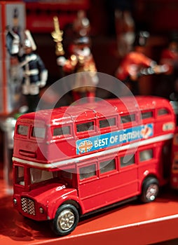 Model of iconic vintage red double decker London bus with slogan \'Best of British\' on the side.