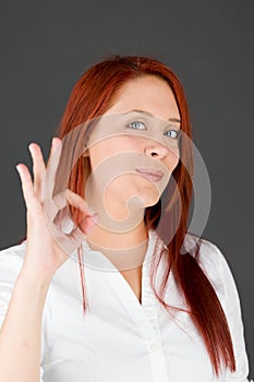 Model isolated on plain background hand gesture ok