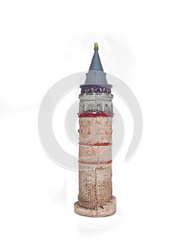Miniature galata tower on white background photo