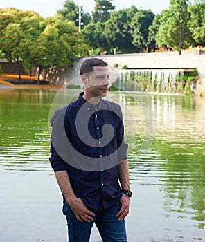 A model in jeans posing relaxed