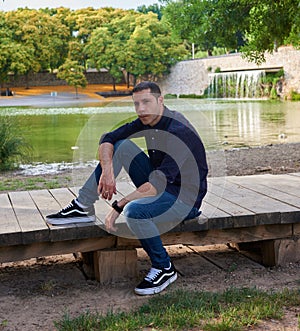 A model in jeans posing relaxed