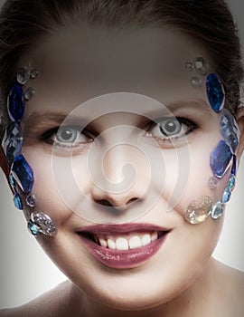 Model with jewels on her face