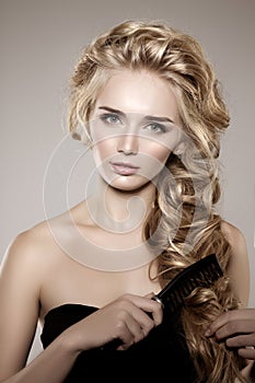 Model with long braided hair. Waves Curls Braid Hairstyle. Hair