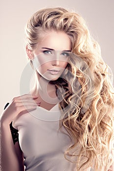 Model with long hair Blonde Waves Curls Hairstyle Hair Salon Updo Fashion model with shiny hair Woman with healthy hair girl with