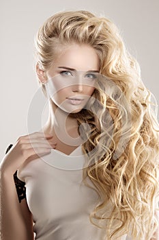 Model with long hair Blonde Waves Curls Hairstyle Hair Salon Updo Fashion model with shiny hair Woman with healthy hair girl with