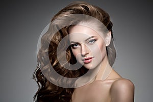 Model with long hair. Waves Curls Hairstyle. Hair Salon. Updo. F