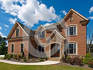 Model Luxury Home Exterior clouds side view