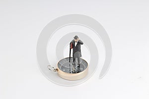 model miniature on compass on white back ground