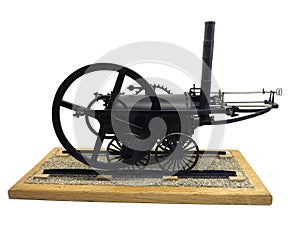 Model of old-fashioned steam engine train isolated on white back