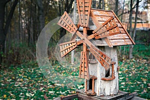 Model of an old wooden wind mill on a children's playground