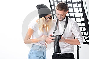Model and photographer are looking through the