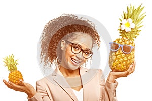 Model with pineapple in hands. African American Girl with Exotic Fruit. Cheerful woman with a smile relaxing on vacation. Image