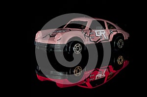 The Model Of  Pink Car With Refllection, Or Red Car  Toy