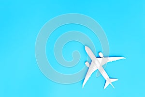 Model plane, airplane on blue pastel color background with copy space.Flat lay design.Travel concept on blue background. top view