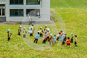 Model police station and rioters at a model village in England
