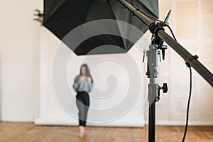 Model poses in photo studio, white background