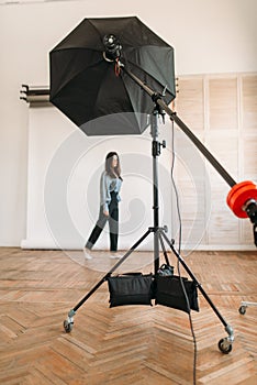 Model poses in photo studio, white background