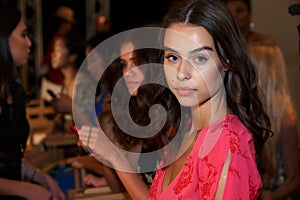 A model posing backstage before the MIKOH Resort 2019 Runway Show