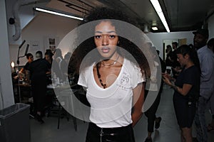 A model posing backstage before the PH5 Presentation