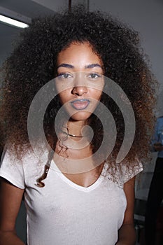 A model posing backstage before the PH5 Presentation