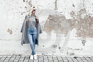 Model posing in plain tshirt against street wall photo