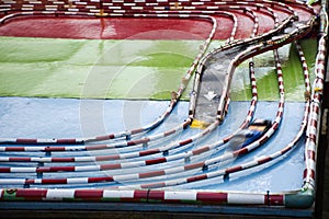 Model racetrack racecourse or racing circuit motorsports and toy car running in pit lane for thai children and kid playing photo