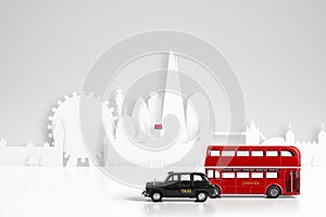 Model red bus and black taxi