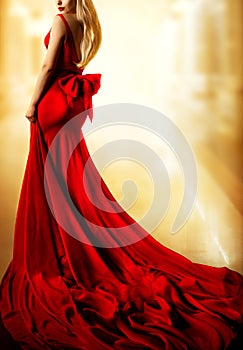 Model Red Dress, Fashion Blonde Woman in long Evening Gown Back Side View. Yellow Lighting Background