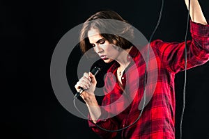 Model Red Flannel Shirt Singing Into Mic