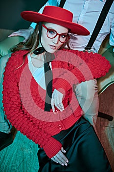 Model in red hat and glasses