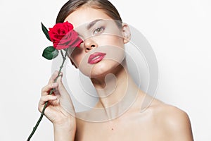 Model Rose in hand red lips charm clean skin long hair