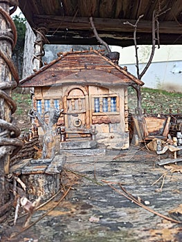 a model of a rural wooden house and yard from the 18th century