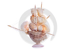Model sailboat of seashells on an isolated background