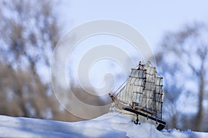 Model of a sailboat on a winter scene