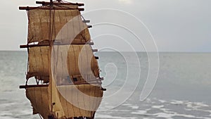 Model of a Sailing Catamaran on the Background of Sea Waves. Boat on a warm day.