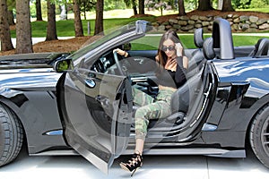 model in sport car beautiful girl with a Ford mustang Roush stage 3 900 HP horse power muscle car.