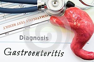 Model of stomach, blood test and stethoscope lying next to written title on paper diagnosis Gastroenteritis. Concept photo of caus