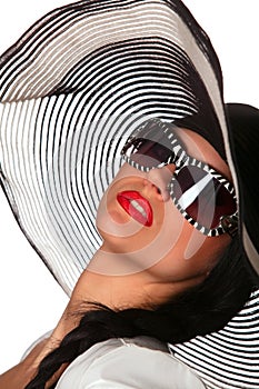 Model in striped hat and sunglasse