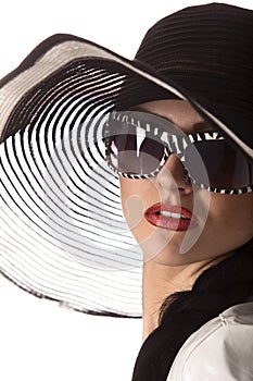 Model in striped hat and sunglasse