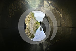 Model in tunnel with picturesque reflection