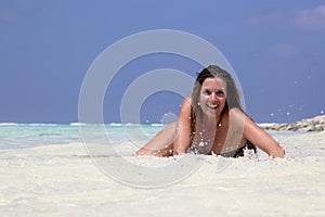 Model in turquoise blue water photo