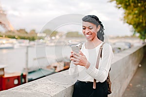 Model walking on street and shooting videos in breaks between photoshoots