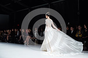 A model walks runway in Dany Tabet dress at the New York Life fashion show during MBFW Fall 2015